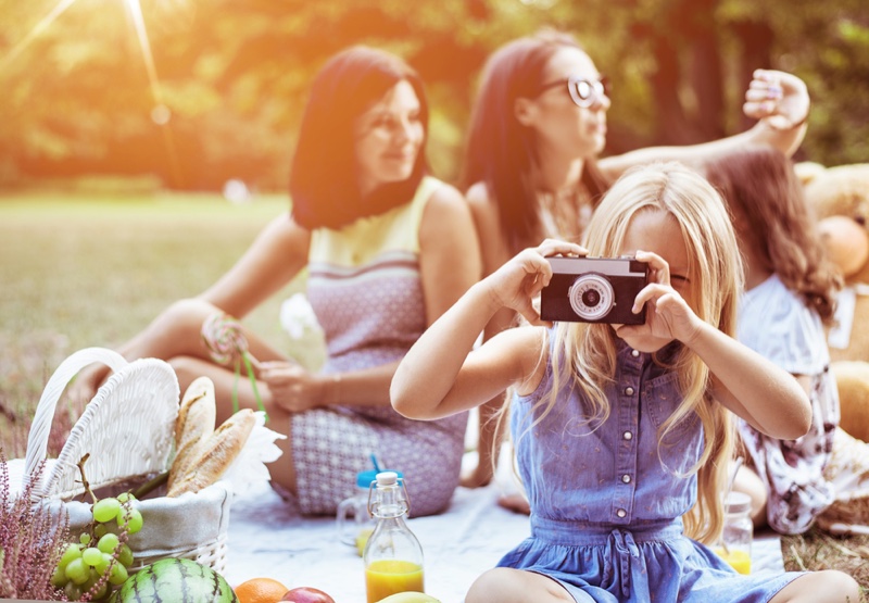 Kids & Mothers Sitting at Park Fashionable