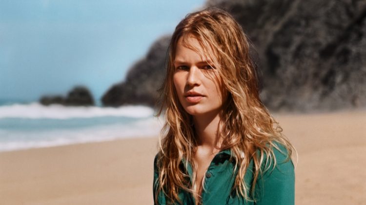 Model Anna Ewers poses on the beach for Marc O'Polo spring-summer 2019 campaign