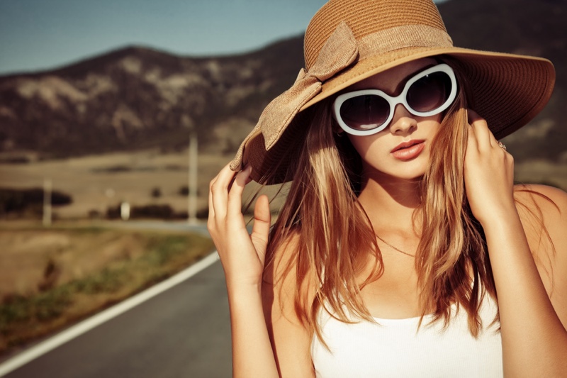 Woman with Hat & Sunglasses on Road