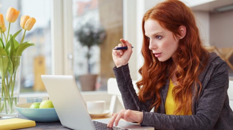 80 Trends in Research Paper Topics for 2019 Woman Typing Laptop Red Hair Wearing Hoodie