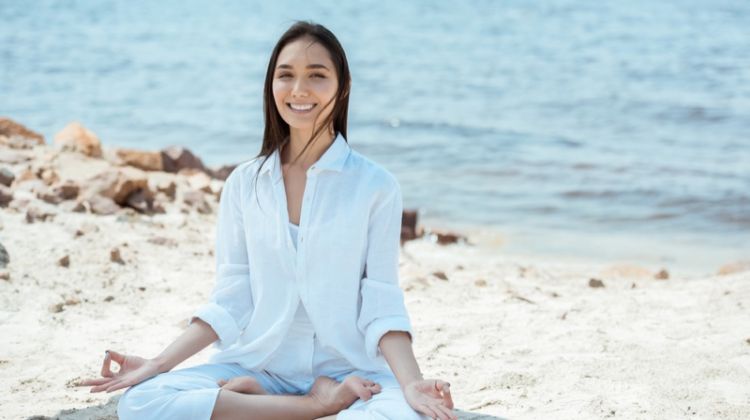 5 Simple Tips to Stay Healthy While Looking Good Woman in Yoga Pose Wearing White Outfit at Beach