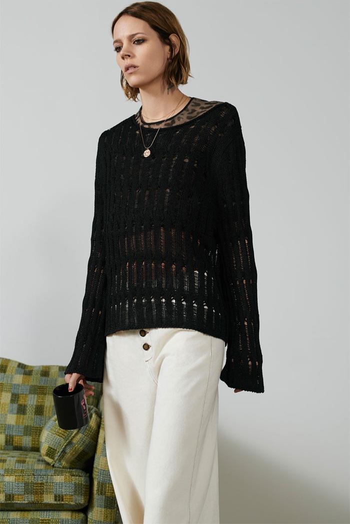 Freja Beha Erichsen poses in Zara open knit sweater and pants with contrasting piping