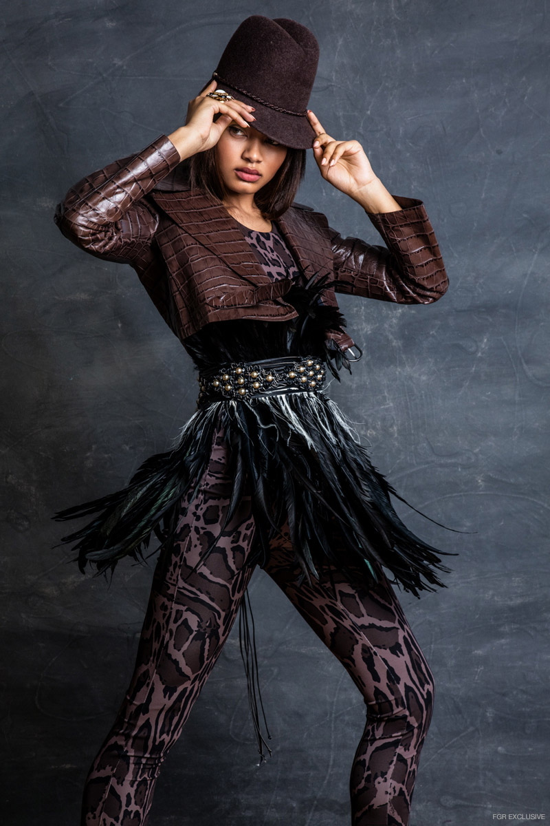 Roberto Cavalli Jacket & Jumpsuit, Erickson Beamon Feather Corset and Wynono Hat. Photo: Eniko Szucs