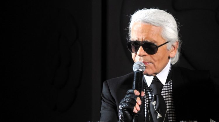 Karl Lagerfeld Holding Microphone