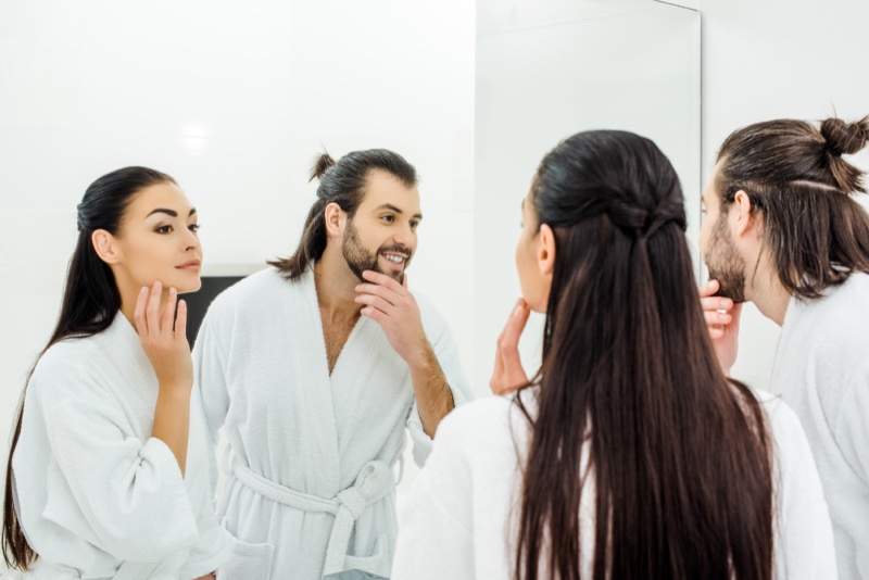 Attractive Couple Morning Routine in Mirror