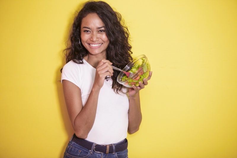 Model Smiling with Salad Wavy Hair White Tee