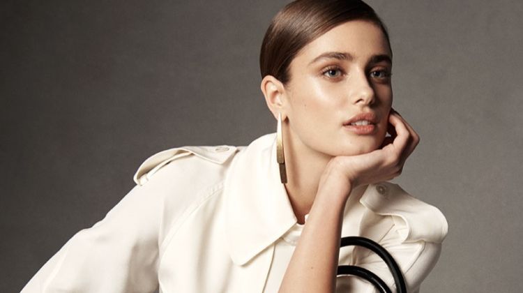 Taylor Hill poses with the RL50 handbag in an oversized silhouette