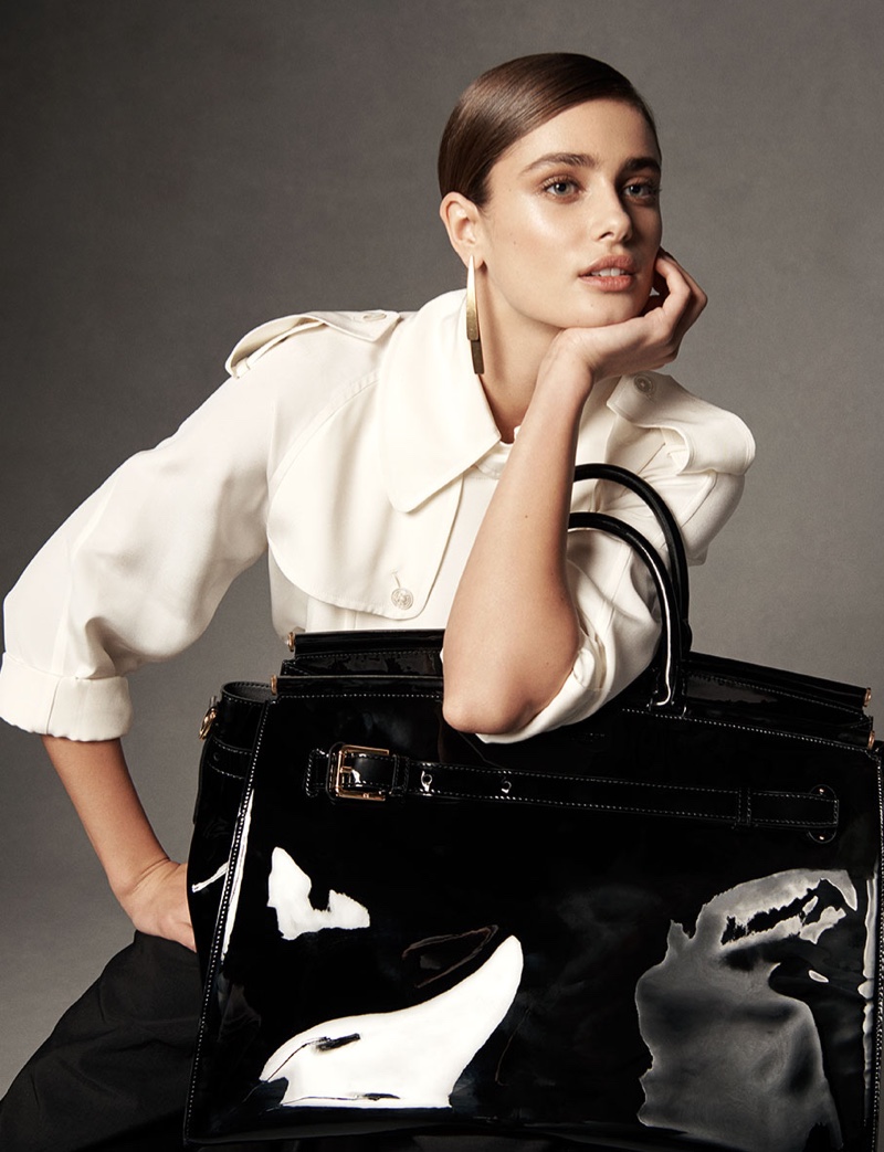Taylor Hill poses with the RL50 handbag in an oversized silhouette
