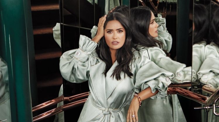 Salma Hayek poses in Peter Pilotto trench coat, Pomellato jewelry and Gucci sandals