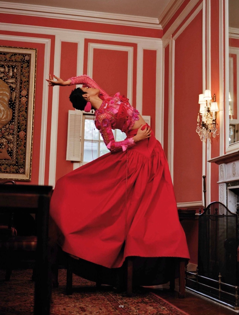 Dressed in red, Teyana Taylor wears Lou De Betoly top, Chanel skirt and Lanvin earrings