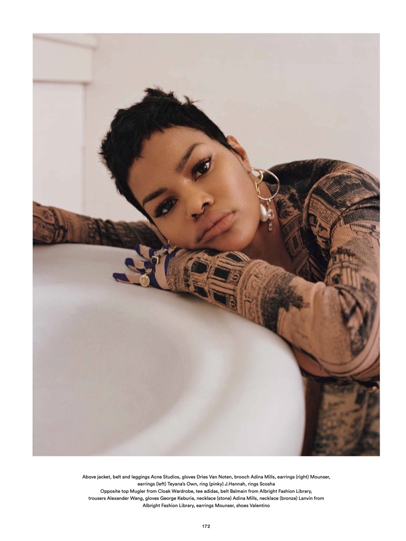 Ready for her closeup, Teyana Taylor wears Acne Studios jacket, belt and earrings with Dries Van Noten gloves