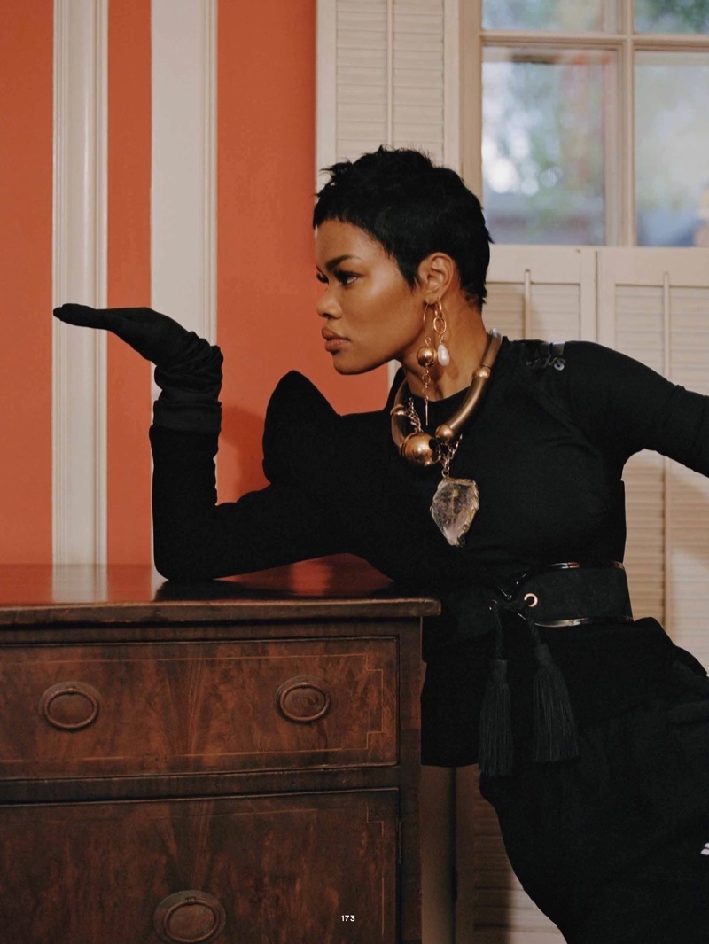 Dressed in black, Teyana Taylor wears Mugler top, Alexander Wang pants and Balmain belt