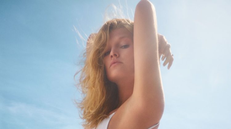 Posing in Malibu, Toni Garrn wears white swimsuit for allSisters spring-summer 2019 campaign