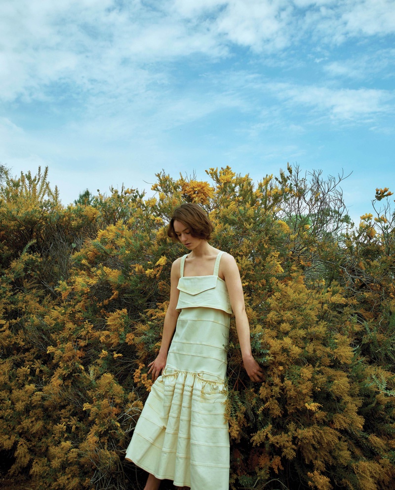 Brigette Lundy-Paine poses in yellow dress