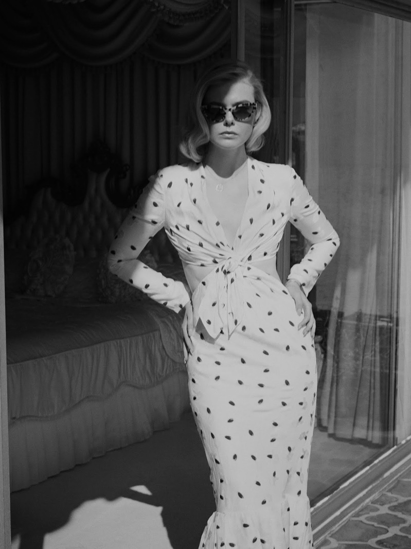 Actress Elle Fanning wears Carolina Herrera dress with Miu Miu sunglasses