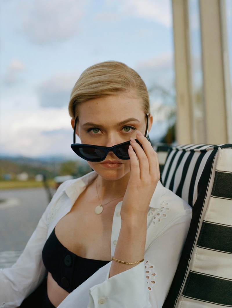 Elle Fanning wears Carolina Herrera dress, Eres bikini top and briefs with Saint Laurent sunglasses