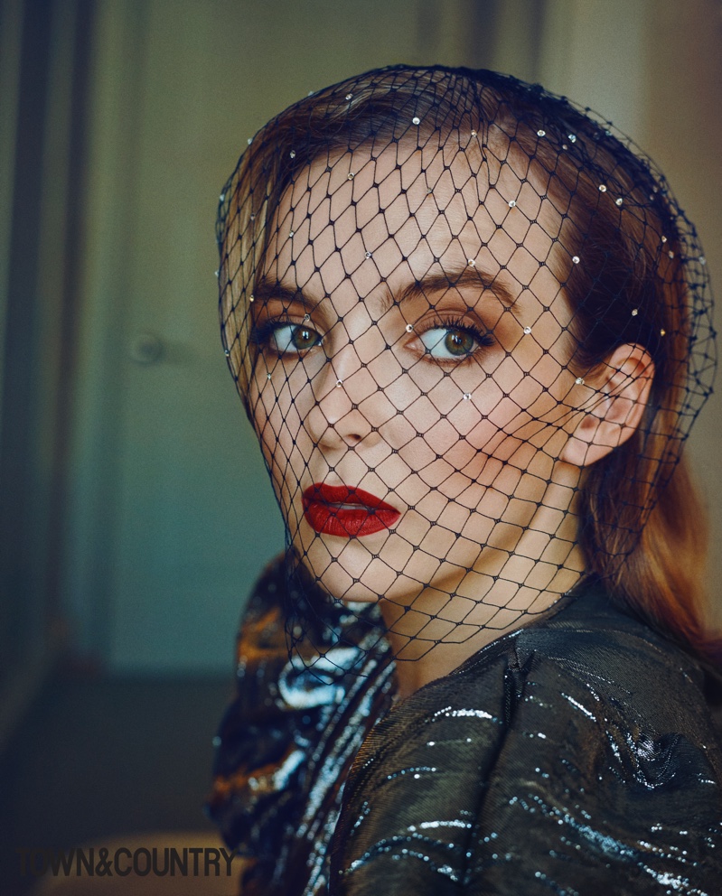 Wearing a Tia Mazza veil, Jodie Comer poses in Michael Kors Blouse