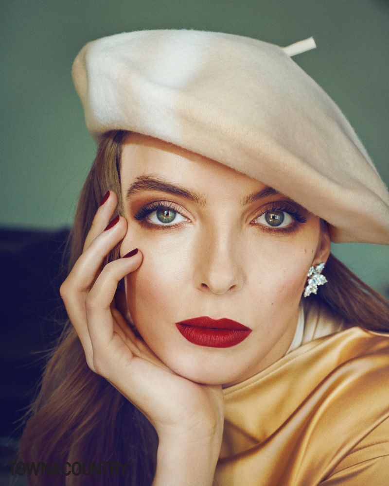 Ready for her closeup, Jodie Comer wears Bottega Veneta dress, Harry Winston earrings and Lola Hats beret