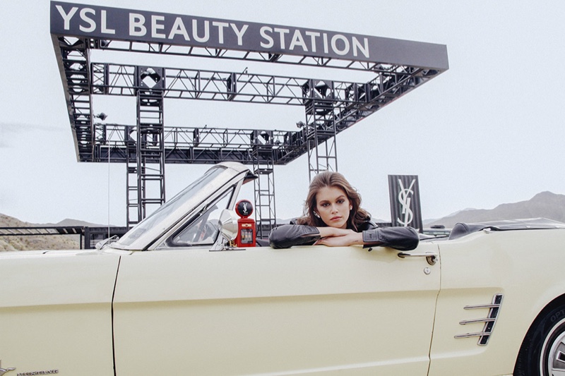Posing in a convertible, Kaia Gerber fronts YSL Beauty Station campaign