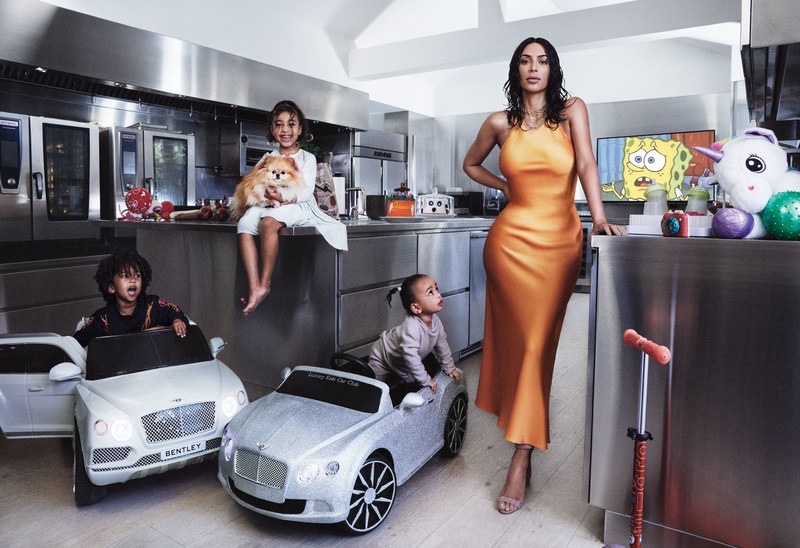 Posing with her children, Kim Kardashian models Rosetta Getty slip dress and Manolo Blahnik heels