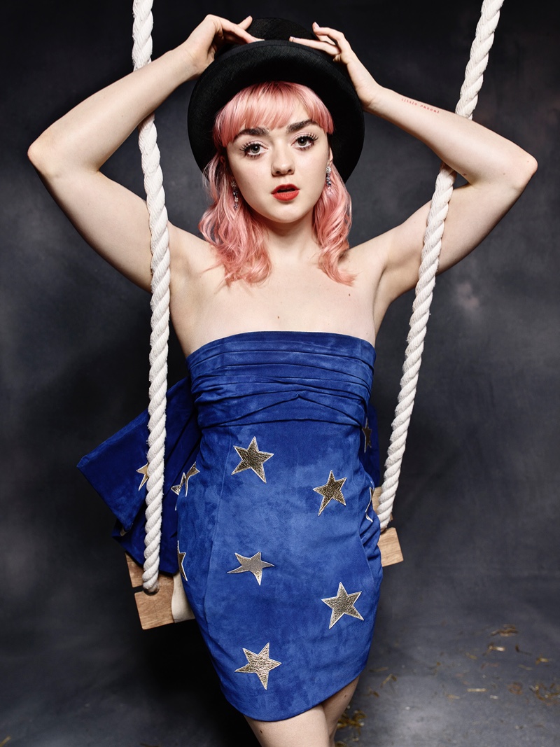 Actress Maisie Williams poses in Saint Laurent dress with Van Cleef & Arpels earrings and Stephen Jones hat. Photo: Rankin