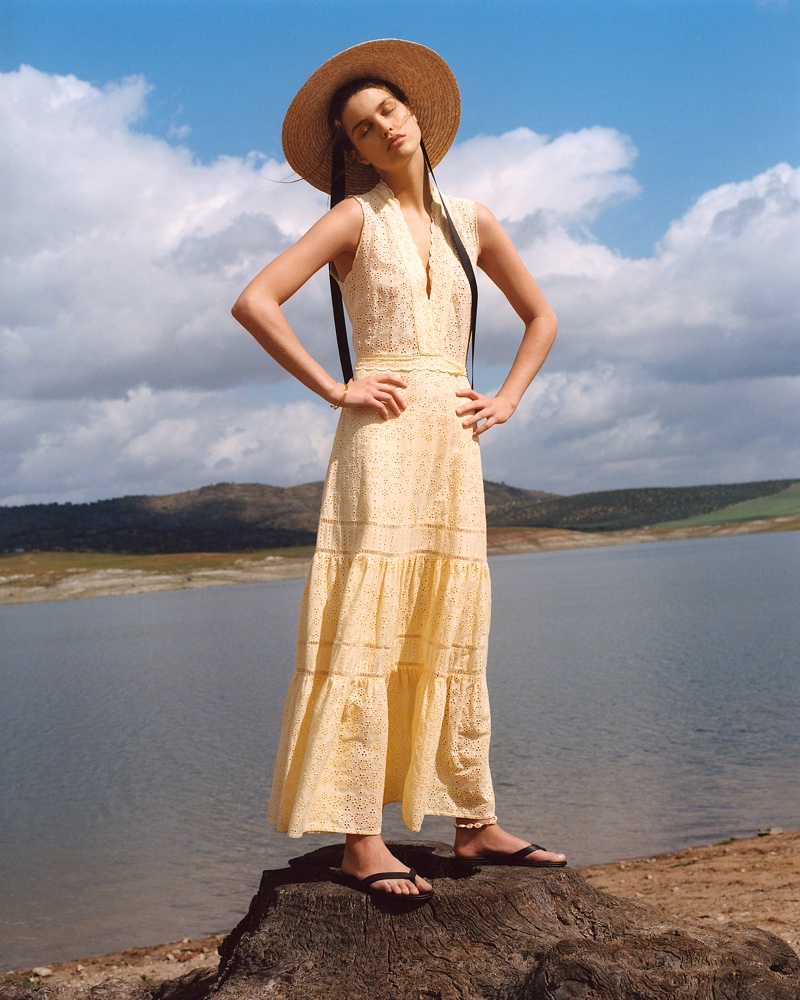 Luna Bijl poses in Mango embroidered midi dress and contrast ribbon hat