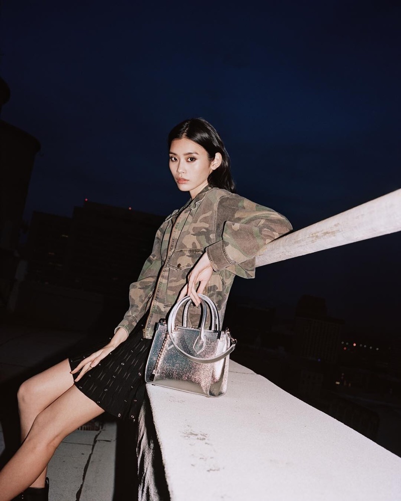 Ming Xi models Ming by The Kooples bag in silver