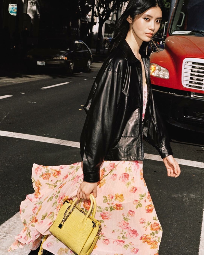 Ming Xi poses with The Kooples bag collaboration in yellow