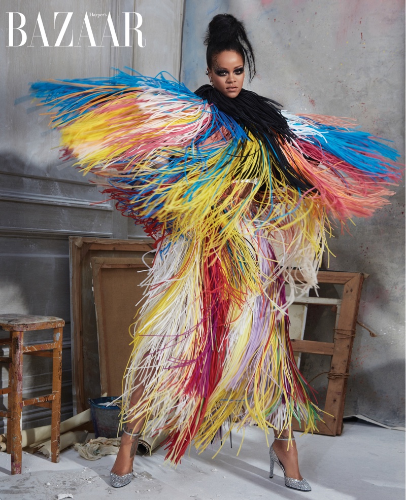 Striking a pose, Rihanna wears Givenchy Haute Couture fringed jacket, dress and shoes