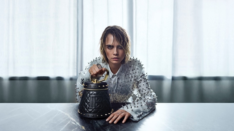 Cara Delevingne poses with Balmain Romeo bag