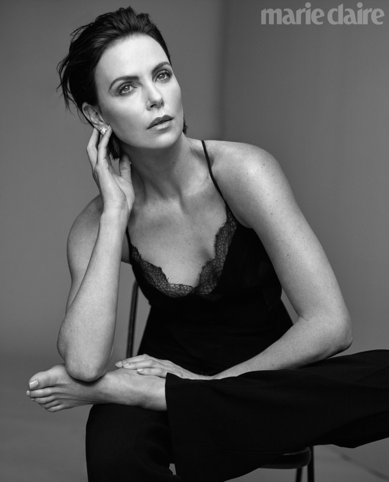 Actress Charlize Theron wears Victoria Beckham top and pants with Bulgari earrings