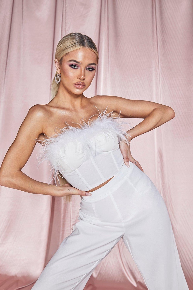 Dressed in feathers, Delilah Belle Hamlin fronts Boohoo Premium Collection campaign