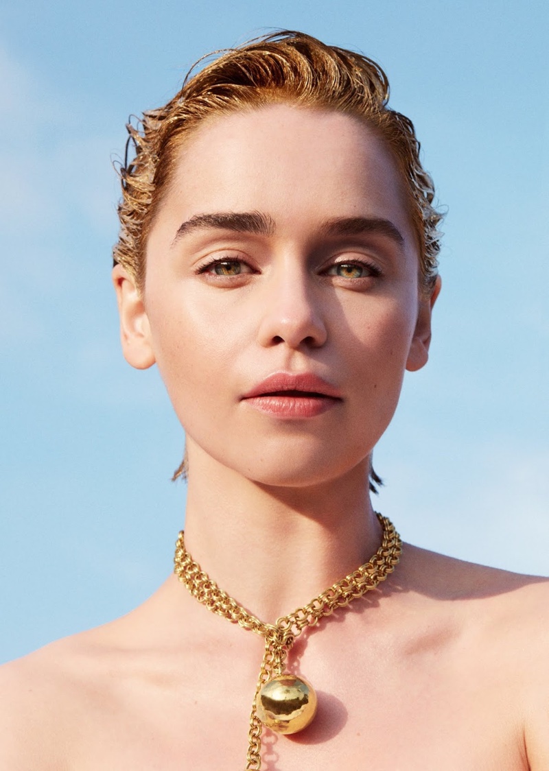 Shining in gold, Emilia Clarke wears Bottega Veneta necklace
