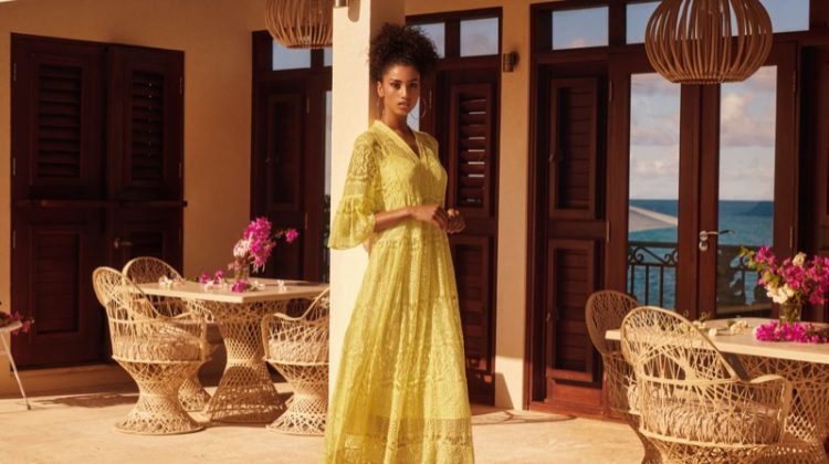 Model Imaan Hammam wears H&M yellow lace dress