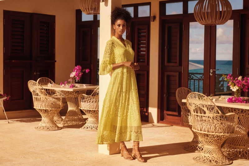 Model Imaan Hammam wears H&M yellow lace dress