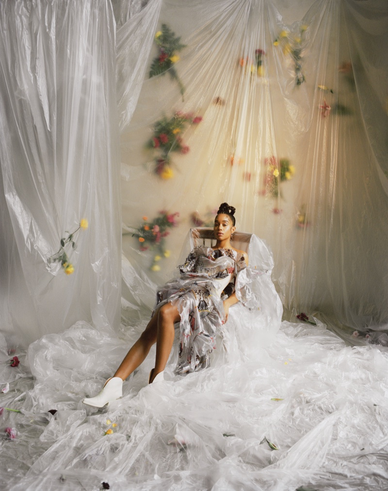 Actress Laura Harrier poses in a room full of flowers. Photo: Mary Rozzi