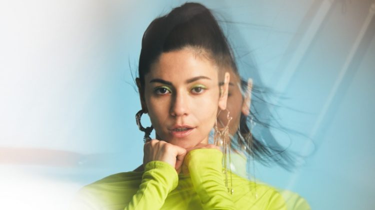 Sporting neon green, Marina Diamandis poses in Versace dress with Givenchy earrings