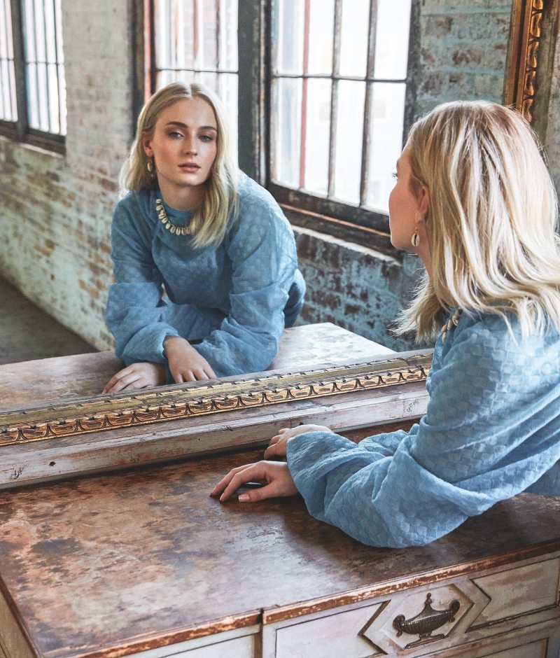 Looking in the mirror, Sophie Turner poses in Kenzo look