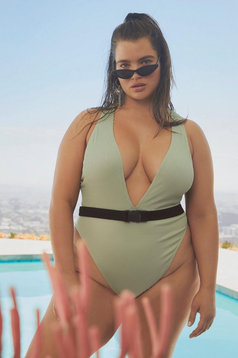 Model Tara Lynn poses in plunging swimsuit from Nasty Gal Curve collection
