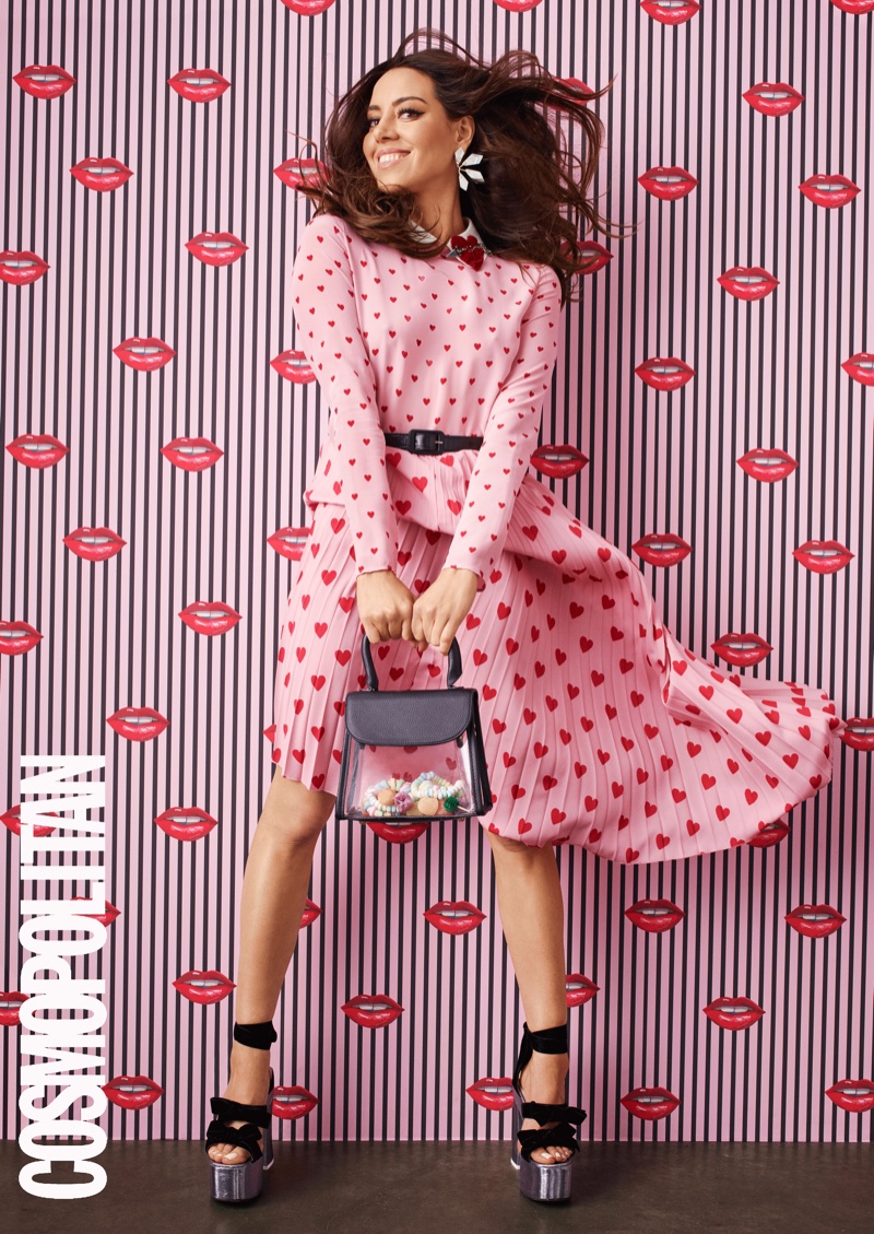 Actress Aubrey Plaza wears heart print dress with platform heels