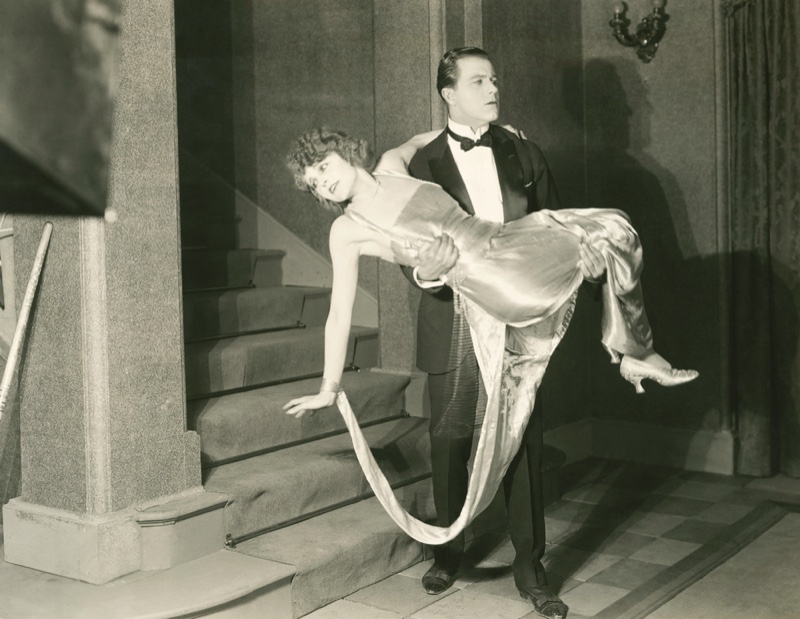 Man Carrying Woman 1920's 1930's Fashion Tuxedo Dress