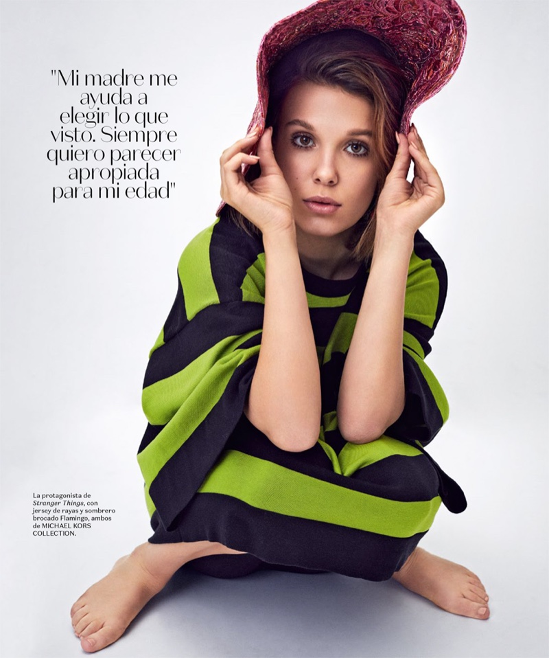Posing in stripes, Millie Bobby Brown wears Michael Kors Collection look