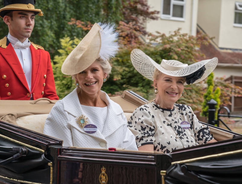 Stylish women during the carriage procession at Royal Ascot