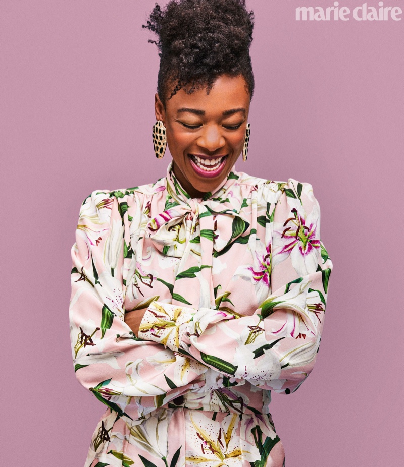 All smiles, Samira Wiley wears Dolce & Gabbana shirt and Chanel earrings