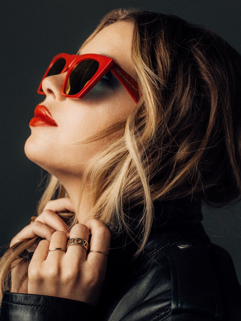 Posing in red shades, Ashley Benzo fronts Prive Revaux Benzo collection