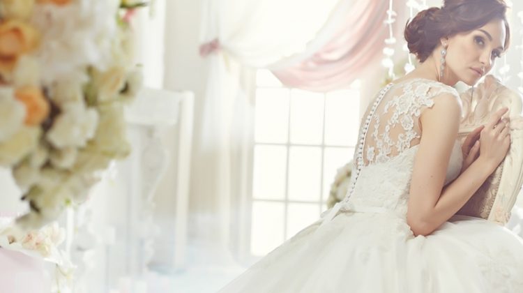 5 Things to Keep in Mind When Shopping for a Wedding Dress Brunette Model Bridal Wedding Dress Chair Back