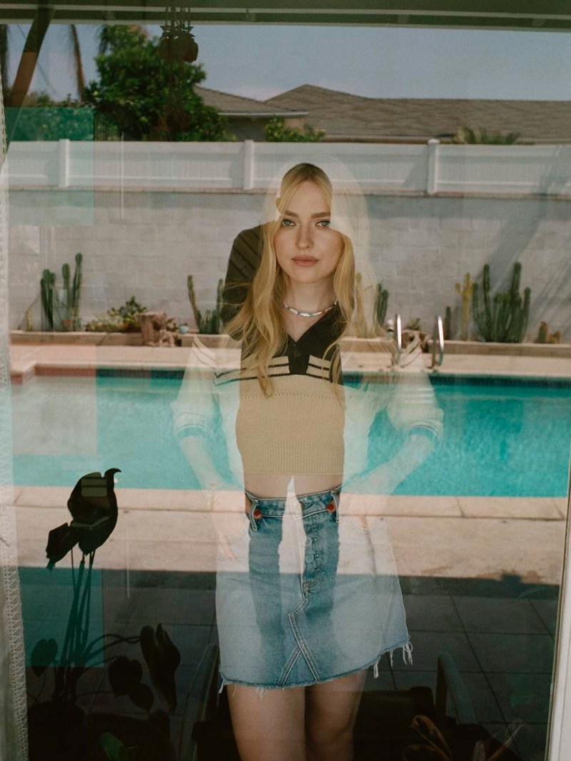 Dakota Fanning wears Miu Miu polo shirt and GRLFRND denim mini skirt