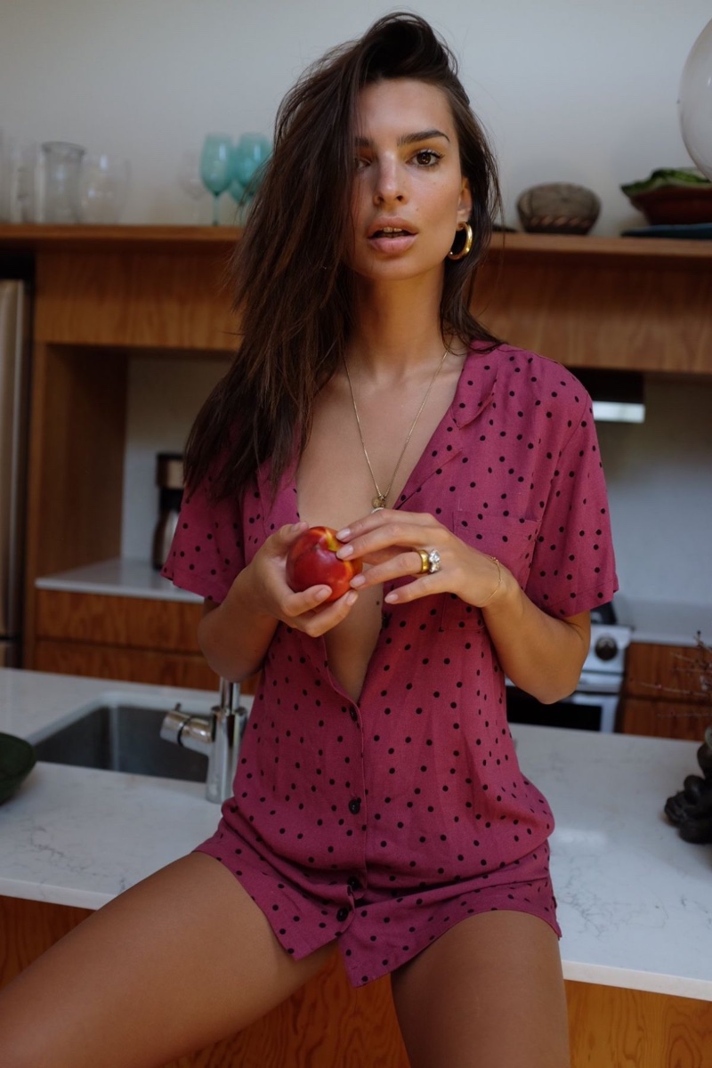 Posing with an apple, Emily Ratajkowski models Inamorata El Camino shirt