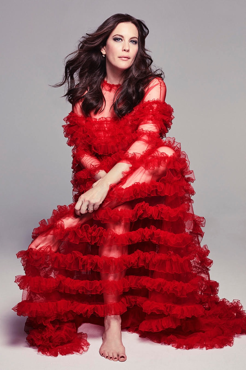 Dressed in red, Liv Tyler poses in Valentino gown