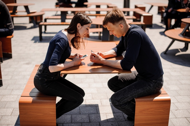 Man Woman Phone Sitting Looking
